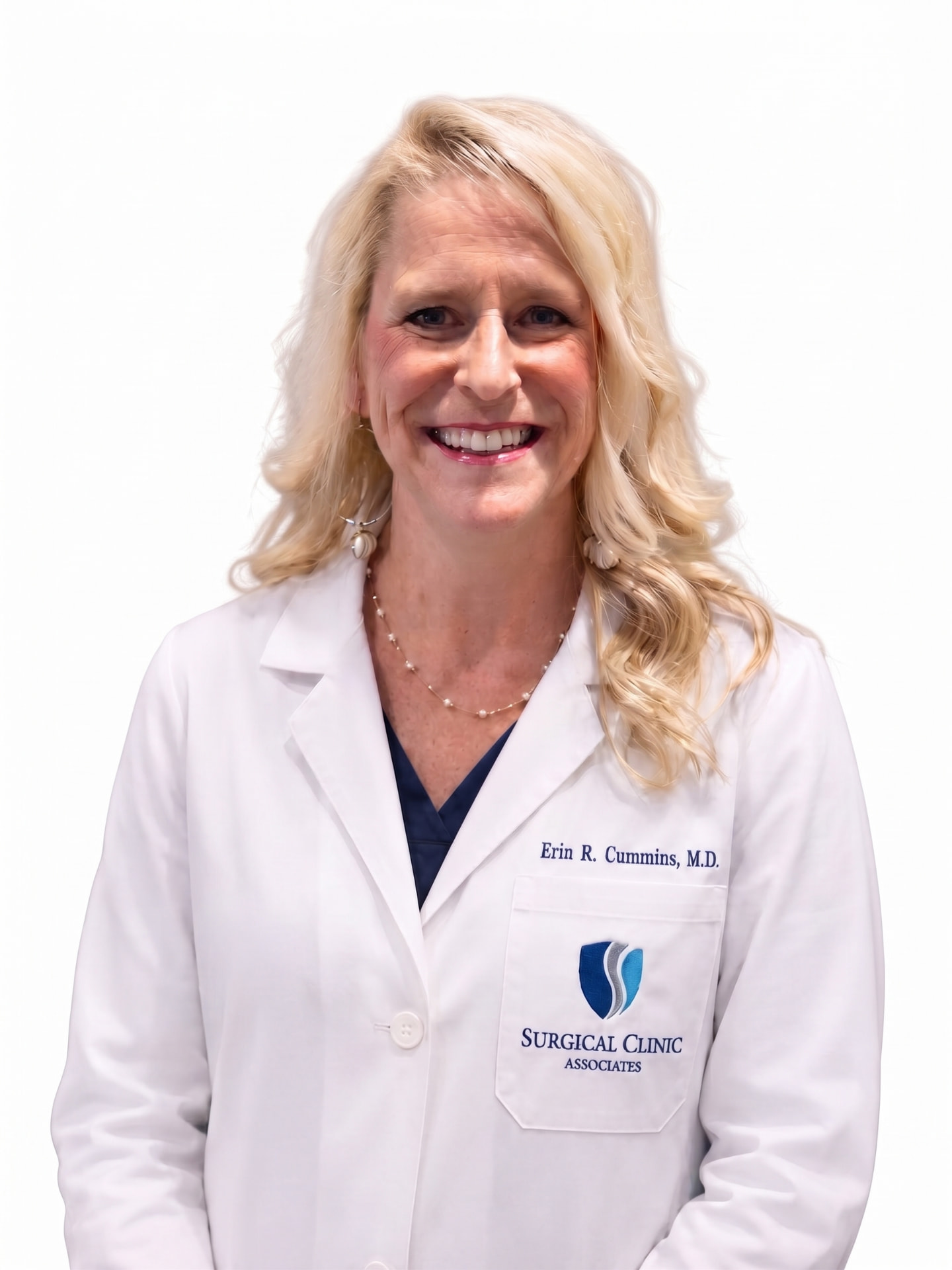 Portrait of Erin R. Cummins, MD, FACS, in a white coat